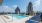 a pool with a city in the background