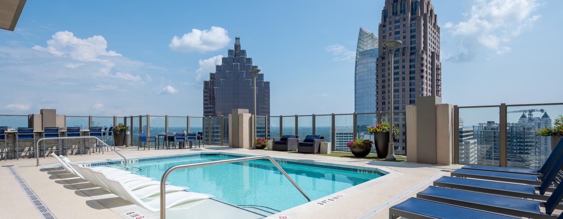 a pool with a city in the background
