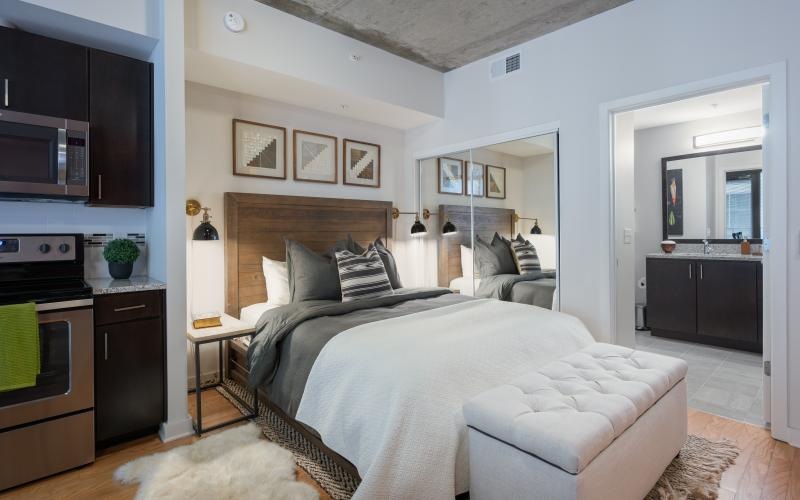 a bedroom with a bed and a couch