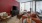 a living room with a red wall