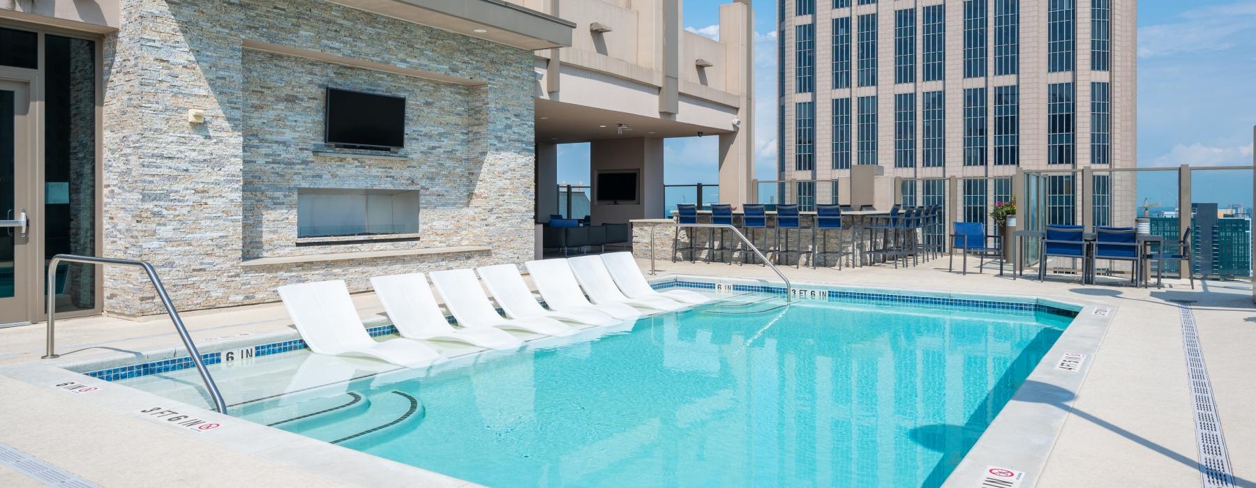 a swimming pool in front of a building