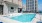 a swimming pool in front of a building