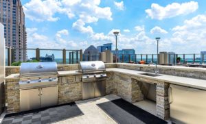 Outdoor kitchen by the Rooftop Pool of Atlantic House Luxury High Rise Apartments in Midtown Atlanta